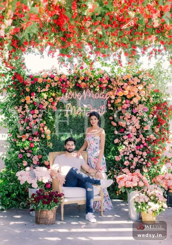 Canary Cane Clicks — red modern photobooth for sangeet & wedding, Wedsy PH028